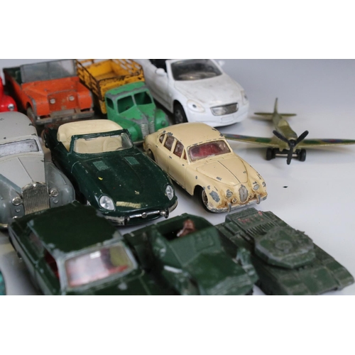 1379 - Over 30 play worn Mid 20th C onwards diecast models, mostly Dinky and Matchbox, to include military ... 