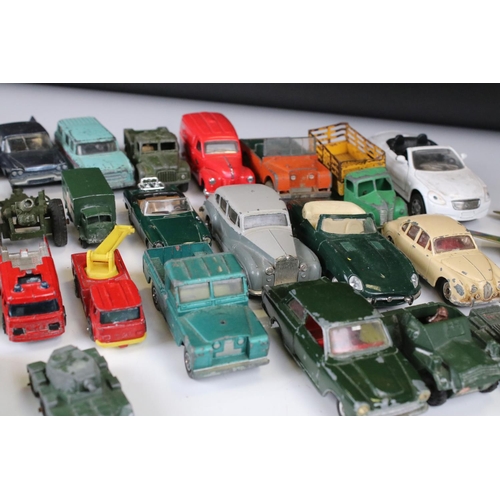 1379 - Over 30 play worn Mid 20th C onwards diecast models, mostly Dinky and Matchbox, to include military ... 