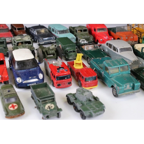 1379 - Over 30 play worn Mid 20th C onwards diecast models, mostly Dinky and Matchbox, to include military ... 