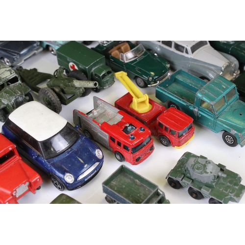 1379 - Over 30 play worn Mid 20th C onwards diecast models, mostly Dinky and Matchbox, to include military ... 