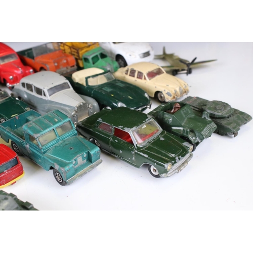 1379 - Over 30 play worn Mid 20th C onwards diecast models, mostly Dinky and Matchbox, to include military ... 