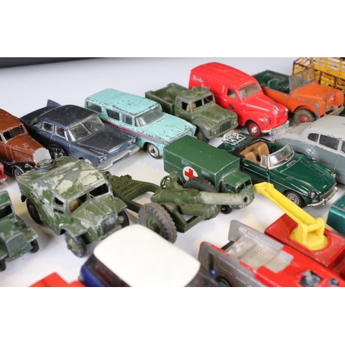 1379 - Over 30 play worn Mid 20th C onwards diecast models, mostly Dinky and Matchbox, to include military ... 