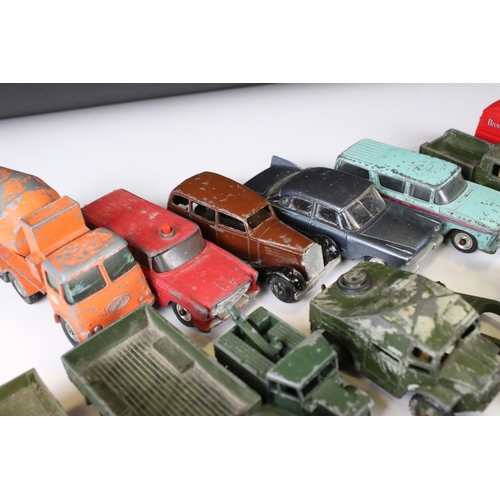 1379 - Over 30 play worn Mid 20th C onwards diecast models, mostly Dinky and Matchbox, to include military ... 