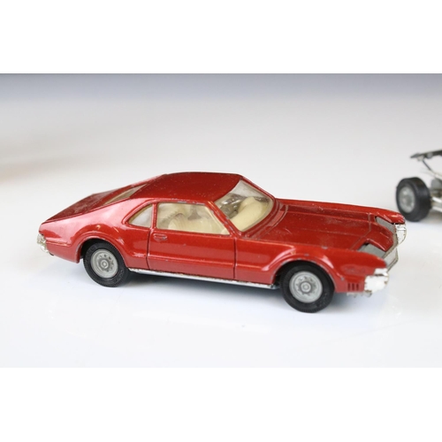 1386 - Boxed Corgi 341 Mini Marcos GT 850 diecast model in metallic red (a few spots of paint loss and box ... 