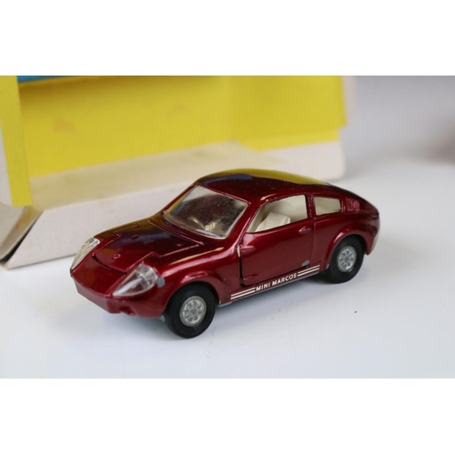 1386 - Boxed Corgi 341 Mini Marcos GT 850 diecast model in metallic red (a few spots of paint loss and box ... 