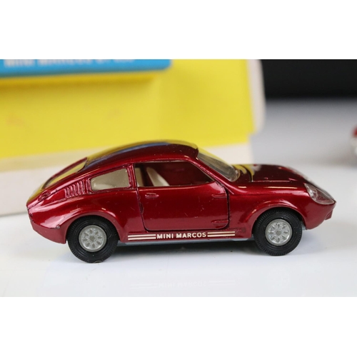 1386 - Boxed Corgi 341 Mini Marcos GT 850 diecast model in metallic red (a few spots of paint loss and box ... 