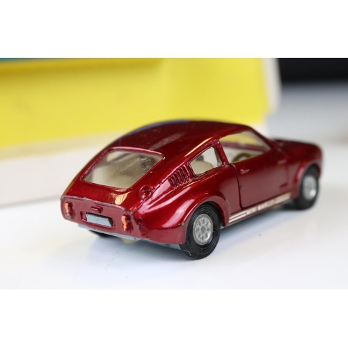 1386 - Boxed Corgi 341 Mini Marcos GT 850 diecast model in metallic red (a few spots of paint loss and box ... 