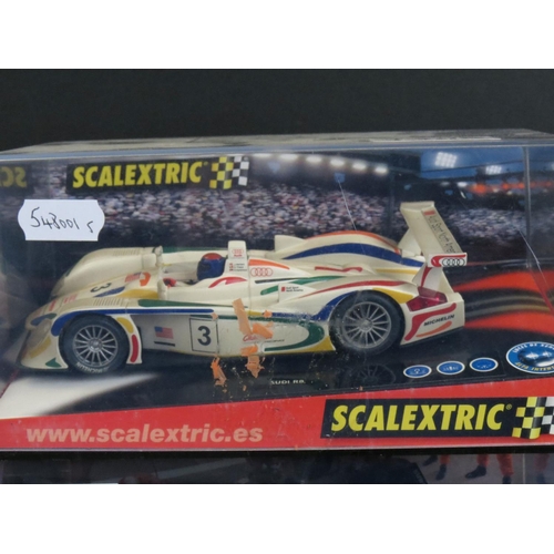 1306 - Five cased Scalextric slot cars to include Cadillac 2000 LMP, Audi R8, TVR Speed 12, Jaguar Racing F... 