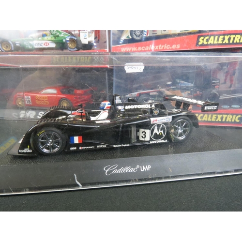 1306 - Five cased Scalextric slot cars to include Cadillac 2000 LMP, Audi R8, TVR Speed 12, Jaguar Racing F... 