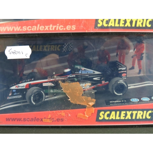 1306 - Five cased Scalextric slot cars to include Cadillac 2000 LMP, Audi R8, TVR Speed 12, Jaguar Racing F... 