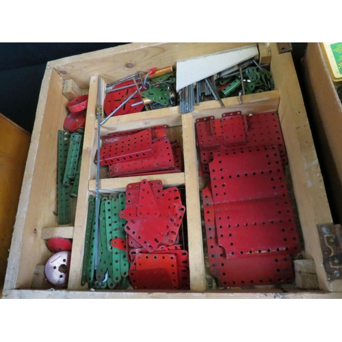 416 - Quantity of Meccano to include wheels, pulleys, angle girders, built seesaw etc, various colours (3 ... 