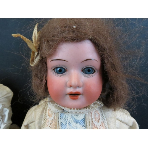 497 - Two Armand Marseille bisque headed dolls to include baby with blue eyes, teeth, marked AM Germany 35... 