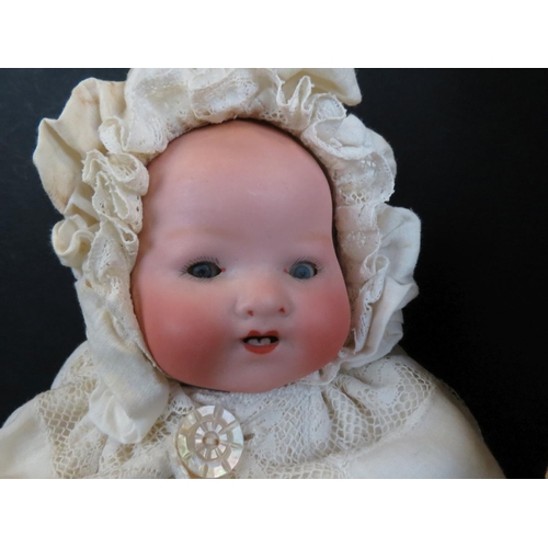 497 - Two Armand Marseille bisque headed dolls to include baby with blue eyes, teeth, marked AM Germany 35... 