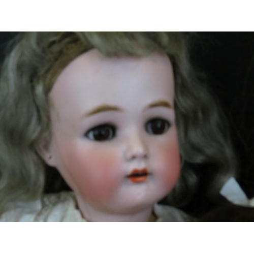 500 - Four early 20th C bisque headed dolls to include Halbig marked K & R, Knauth, etc, showing some wear