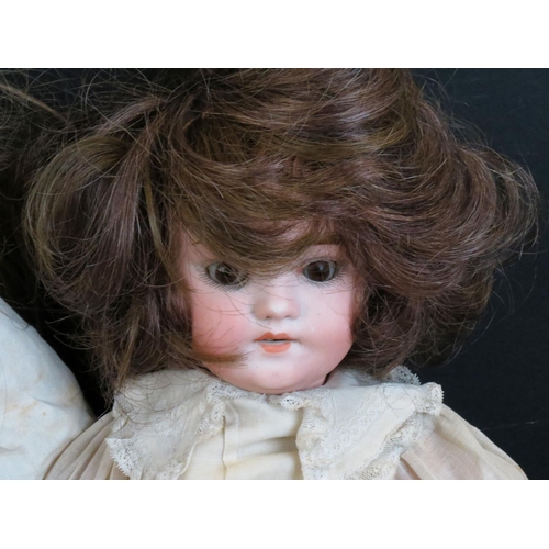 500 - Four early 20th C bisque headed dolls to include Halbig marked K & R, Knauth, etc, showing some wear