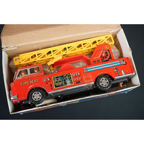 506 - Six boxed tinplate model vehicles, to include W E Ladder Fire Engine, Fiat Car Transport truck, Grea... 