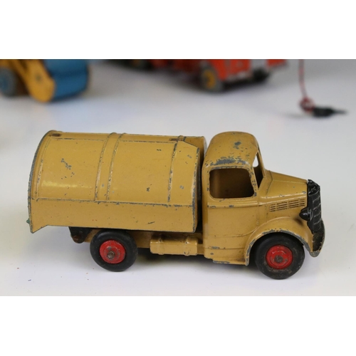 1391 - Eight mid 20th C play worn construction and commercial diecast models to include Dinky & Corgi examp... 