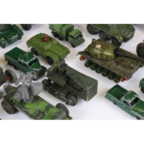 1392 - Around 45 mid 20th C onwards play worn diecast military models to include Dinky, Lone Star, Britains... 