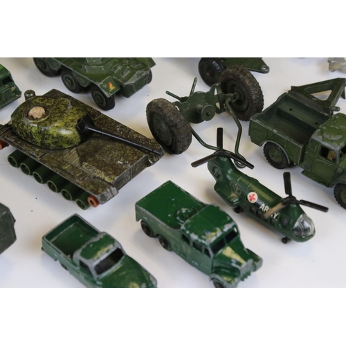 1392 - Around 45 mid 20th C onwards play worn diecast military models to include Dinky, Lone Star, Britains... 