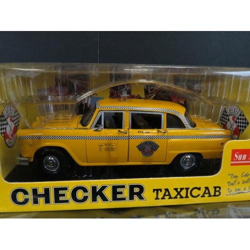 1322 - Two boxed Sun Star 1/18 diecast models to include 2501 Checker Taxicab and The New Millennium Editio... 