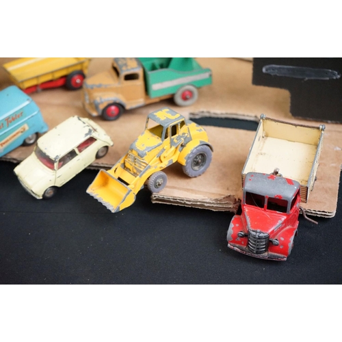 1396 - Over 40 mid 20th C play worn diecast models to include Dinky & Corgi examples featuring road, farmin... 