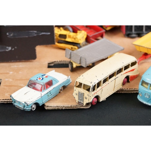 1396 - Over 40 mid 20th C play worn diecast models to include Dinky & Corgi examples featuring road, farmin... 