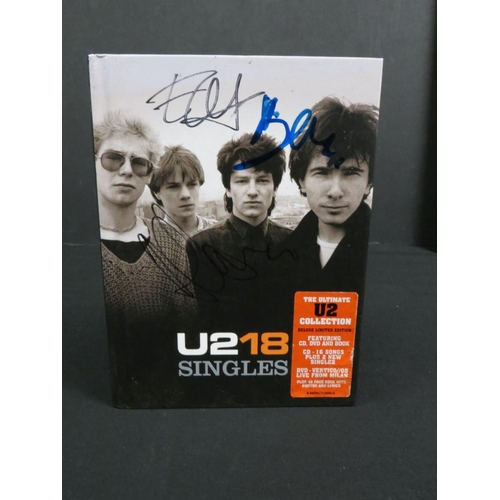 387 - Music Autograph - U2 18 Singles Box Set signed to the cover by 3 of the band including Bono & Edge, ... 