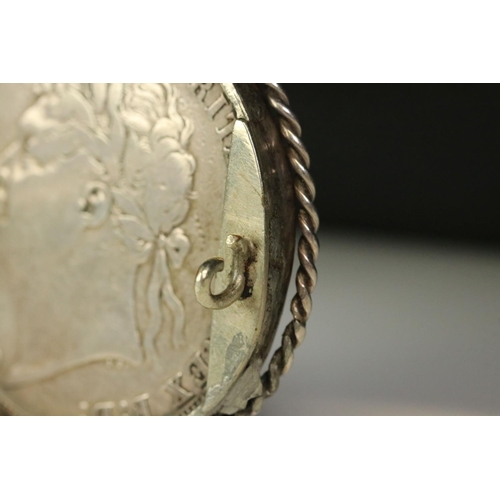 31 - Two King George III silver full crown coins to include a 1820 and an 1822 example mounted as a brooc... 