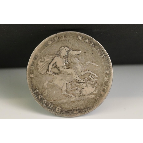 31 - Two King George III silver full crown coins to include a 1820 and an 1822 example mounted as a brooc... 