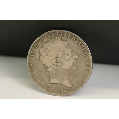 31 - Two King George III silver full crown coins to include a 1820 and an 1822 example mounted as a brooc... 
