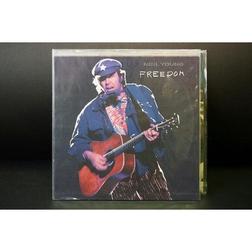 149 - Vinyl - 14 Neil Young LPs spanning his career to include original pressings and reissues.  Condition... 