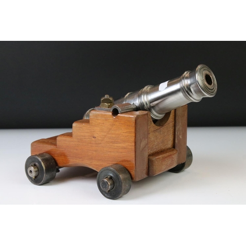 119 - 20th century GWR signal cannon with a steel barrel hinged on an oak carriage, raised on four steel w... 