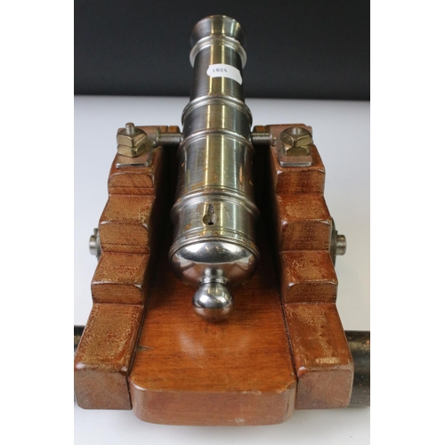 119 - 20th century GWR signal cannon with a steel barrel hinged on an oak carriage, raised on four steel w... 
