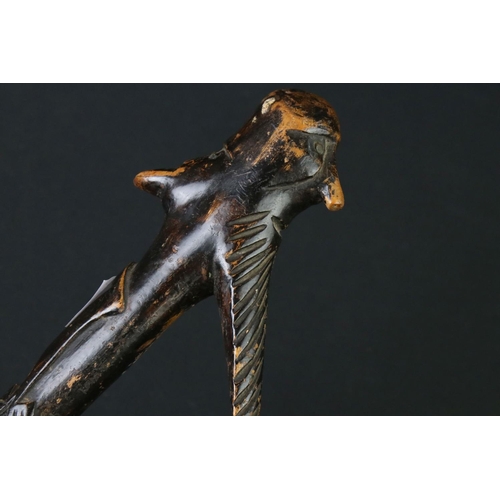 124 - 20th century tribal style carved wooden walking stick with figural two-faced handle; snake, animal m... 