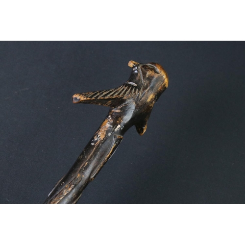 124 - 20th century tribal style carved wooden walking stick with figural two-faced handle; snake, animal m... 