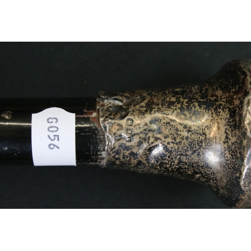 125 - George V ebonised walking stick with silver terminal, London 1923, 92.5cm long, together with a tape... 