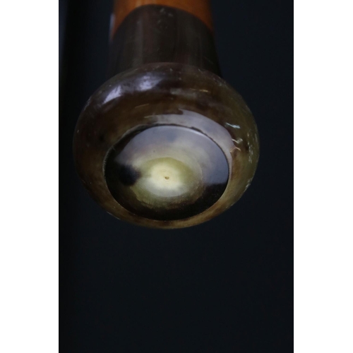 125 - George V ebonised walking stick with silver terminal, London 1923, 92.5cm long, together with a tape... 