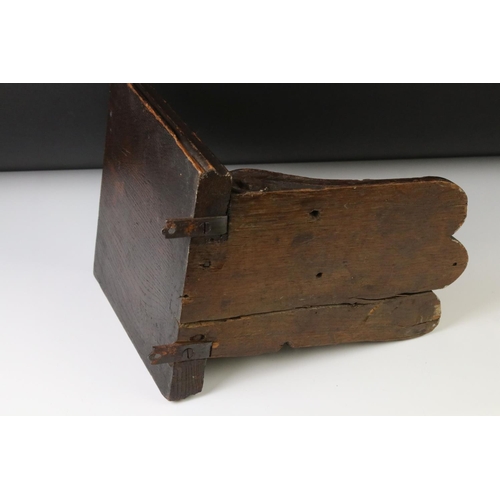 131 - Antique carved oak wall bracket in the form of a lion mask, with square shelf, approx 28cm high