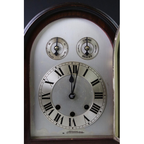 136 - Edwardian mahogany chiming mantle clock with arched silvered dial, poker-style hands, slow/fast and ... 