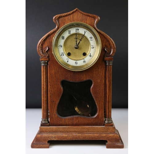 138 - Early 20th Century Arts & Crafts style oak mantle clock with cream dial, Arabic numerals, bevelled g... 