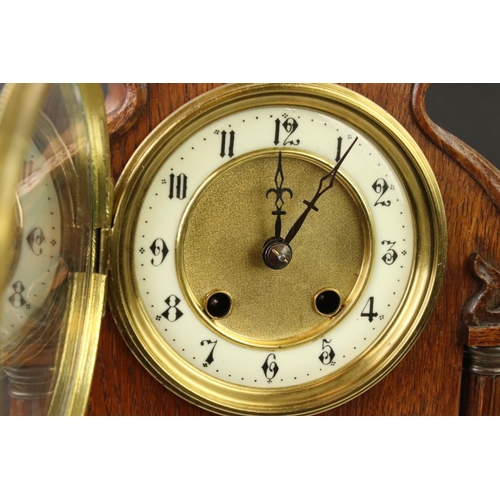 138 - Early 20th Century Arts & Crafts style oak mantle clock with cream dial, Arabic numerals, bevelled g... 