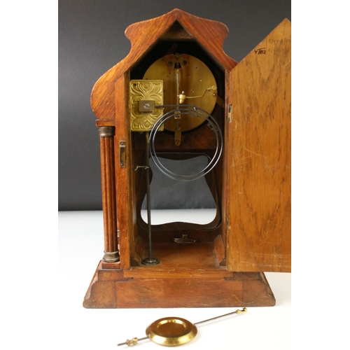 138 - Early 20th Century Arts & Crafts style oak mantle clock with cream dial, Arabic numerals, bevelled g... 