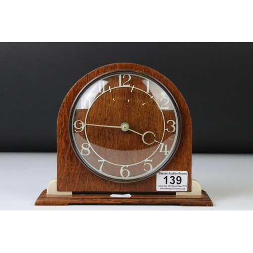 139 - Art Deco style Smiths oak and Bakelite mantle clock of arched form, with cream Arabic numerals, conv... 