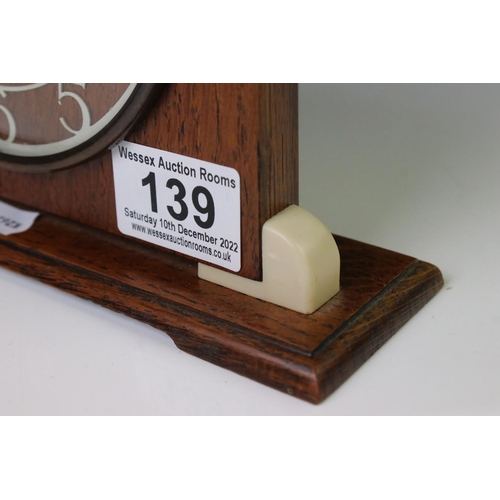 139 - Art Deco style Smiths oak and Bakelite mantle clock of arched form, with cream Arabic numerals, conv... 