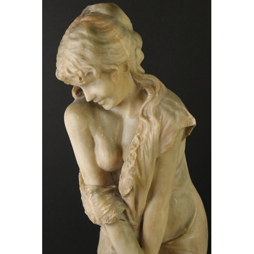 141 - Art Nouveau alabaster figure of a classical maiden, loosely dressed, mounted on a green polished sto... 