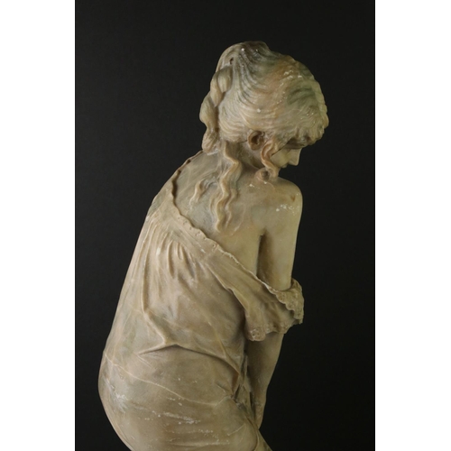 141 - Art Nouveau alabaster figure of a classical maiden, loosely dressed, mounted on a green polished sto... 