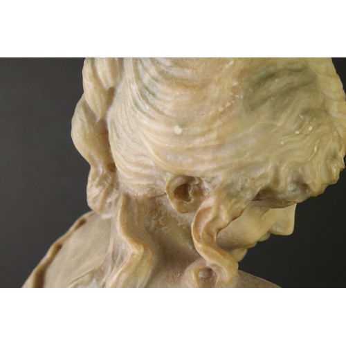 141 - Art Nouveau alabaster figure of a classical maiden, loosely dressed, mounted on a green polished sto... 