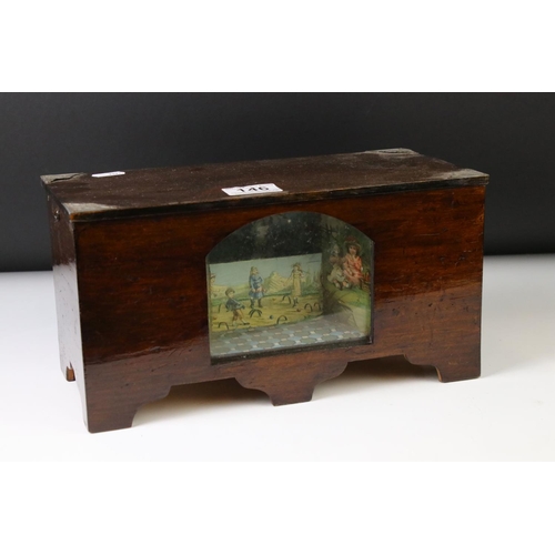 146 - Novelty stained pine music box, with an arched glass panel to the front enclosing a chromolithograph... 