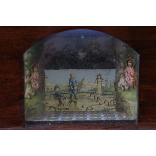 146 - Novelty stained pine music box, with an arched glass panel to the front enclosing a chromolithograph... 