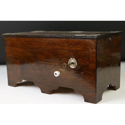 146 - Novelty stained pine music box, with an arched glass panel to the front enclosing a chromolithograph... 